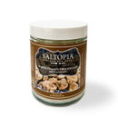 A 6-ounce glass jar of SALTOPIA Infused Sea Salts, labeled Saltopia Truffle Salt, White Italian Truffles: DIRTY WEDDING, features an image of Italian white truffles on the front.