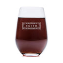Stemless wine glass from The Classic collection filled with red wine, featuring a decorative rectangular engraving that reads SMITH on this personalized glassware.