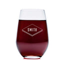 Wine Decanter - The Diamond stemless personalized glassware containing red wine, featuring the name SMITH engraved inside a diamond-shaped border.