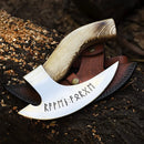 The Texan Knives Custom Hand Engraved Ax Pizza Cutter features an 8-inch J2 steel blade with runic inscriptions, a wooden handle, and comes with a leather sheath, displayed atop a log with wood shavings.