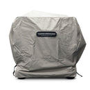 A Yoder Smokers 24×48 Flat Top Grill is shielded by a fitted, light gray Yoder Smokers All-Weather Cover with the brand logo on the front. The cover fits snugly around the grill and has some folds.