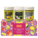 The SALTOPIA Citrus Lovers Gift Set features three infused sea salts—Lemon Thyme, Lime Garlic, Lemon Pepper—in a vibrant box adorned with citrus illustrations. These finishing salts add bright flavor to any dish.