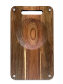 The NULU Signature Cutting Board by NULU Inc. is a rectangular wood cutting board featuring a convenient handle slot at the top and four sturdy metal rivets in each corner. Its distinctive circular wood grain pattern in the center adds visual appeal, while its no-slip design ensures enhanced stability during food preparation.