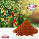 A vibrant pile of Rico Rico Arbol Chile Powder Shaker is displayed in front of fresh red chilies still on the plant, with a "Made in Mexico" stamp featured in the corner. Ideal for authentic Mexican cuisine, the Rico Rico brand label is clearly shown at the bottom, guaranteeing you enjoy only natural seasonings.