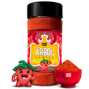 A Rico Rico Arbol Chile Powder Shaker featuring a vibrant label, accompanied by a small red chili mascot figure and a red bowl filled with powder, all displayed on a white background—ideal for enhancing your favorite Mexican dishes with the authentic, natural seasonings of the Rico Rico brand.