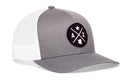 The Haka Hat Arizona Trucker Hat | AZ X Snapback by Haka Hat features a gray and white mesh design with a black circular patch that displays a star, the letters “A” and “Z,” and an outline of the state of Arizona. This signature 5.0 trucker hat is finished with an adjustable snapback closure for a comfortable fit.