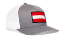 Gray Haka Hat Austria Flag International Trucker Hat with a white mesh back and a rectangular patch featuring the red and white Austrian flag on the front.