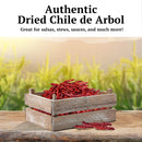 A wooden crate filled with Rico Rico Chile de Árbol Dried Chiles – Hot & Authentic Mexican Peppers rests on a wooden surface, set against a blurred field and sky. Text above reads: Rico Rico Chile de Árbol – delivering bold, authentic Mexican flavor straight to your kitchen.