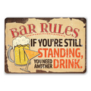 The Bar Rules - Metal Sign by Lone Star Art features a beer mug and cocktail glass with the text: “If you’re still standing, you need another drink.” Fun bar decor for any space!.