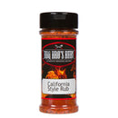 A clear plastic bottle of BBQ Bros Rubs California Style BBQ Rub 4 oz, featuring a black lid and fiery background design, holds a reddish, garlic-forward seasoning from BBQ Bros Rubs that works as an all-purpose rub for grilling.