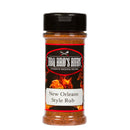 A clear plastic bottle of BBQ Bros Rubs New Orleans Style BBQ Rub 5oz, featuring a black lid and a vibrant, fiery background on the label, contains an orange-brown Cajun seasoning blend from BBQ Bros Rubs—perfect for adding bold New Orleans flavor to your next seafood boil.