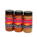 Three spice jars labeled Carolina Style, Memphis Style, and New Orleans Style from BBQ Bros Rubs—with black lids and vibrant labels—are arranged side by side on a white background. The BBQ Bros Rubs Southern Style BBQ Rub Gift Set (Large 3-Pack) highlights classic Southern barbecue flavor with its selection of Memphis, Carolina, and New Orleans style rubs.