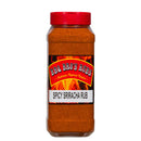 A clear plastic container with a vibrant red lid holds 1 lb of BBQ Bros Rubs Spicy Sriracha BBQ Rub. The label, featuring dynamic flame graphics and a striking red and yellow design, perfectly captures the bold essence of this seasoning blend. Inside, you’ll find an orange-red BBQ rub ideal for grilling and infusing your favorite dishes with a fiery sriracha kick.