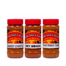 Three large BBQ Bros Rubs spice jars with red lids—Smokey Chipotle, Spicy Sriracha, and Sweet Honey Cajun—are displayed side by side. Each label showcases vibrant flames and highlights Authentic Regional Recipes, making the BBQ Bros Rubs Sweet, Smokey & Spicy BBQ Rub Gift Set (Large 3-Pack) the perfect choice for any grilling enthusiast.