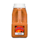 A clear plastic container with a white lid, filled with orange spice, features a label that reads BBQ Bros Rubs Texas Style BBQ Rub 5 lb Tailgate Edition. This Texas Style BBQ Rub by BBQ Bros Rubs is perfect for adding authentic Texas barbecue flavor to your favorite dishes and serves as an ideal brisket seasoning.
