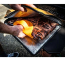 Drip EZ BBQ Grill Mitts – Heat-Resistant Silicone Gloves for Grilling & Smoking shown in use with meat in butcher paper