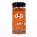 A 12 oz bottle from the DDR BBQ Supply Top 10 Store-Bought BBQ Chicken Rubs Variety Pack, featuring an orange label with a chicken graphic and white text, is perfect for anyone looking to add championship-worthy chicken seasonings to their BBQ creations.
