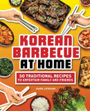 Cover of *Korean Barbecue at Home: 50 Traditional Recipes to Entertain Family and Friends - Paperback* by Books by splitShops, featuring hands with chopsticks reaching for classic Korean dishes such as grilled meats, kimchi, and rice. The cover emphasizes 50 traditional Korean barbecue recipes perfect for entertaining family and friends.