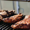 Close-up of grilled tri tip meat on a barbecue grill 