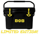 A black Bob The Cooler Co. 25QT "Wingman" Hard Cooler with yellow latches and the word "BOB" in yellow on the front. This LIMITED EDITION cooler features a convenient bottle opener and has "LIMITED EDITION!" written in large yellow letters at the bottom.