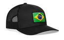 The Haka Hat Brazil Flag International Trucker Hat is a black mesh snapback by Haka Hat, featuring a rectangular patch of the Brazilian flag on the front panel.