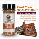 A bottle of B.T. Leigh’s Sweet & Savory BBQ Rub sits next to a rack of glazed ribs, with text highlighting the ingredients and usage.