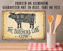 The Lone Star Art Butcher’s Cut Cow Diagram Sign is a vintage-style aluminum sign showing labeled beef cuts. This rust-free, fade-resistant décor adds charm to your kitchen, with a utensil holder placed nearby.
