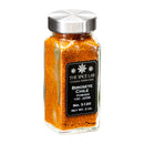 A glass spice jar with a silver lid holds vibrant orange-red The Spice Lab Birdseye Chili Pepper Powder, made from finely ground chile. Featuring a black label that reads The Spice Lab Birdseye Chili Pepper Powder, 100-225K, No. 5120, Net Wt. 2 oz., this product showcases the fiery essence of authentic bird’s eye chile in every sprinkle.