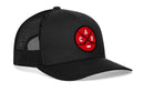 The Haka Hat Carolina Hockey Trucker Hat | Red CAR X Snapback is a black mesh 5.0 trucker style hat with a red circular patch on the front, featuring black crossed hockey sticks, the letters C, A, and R, and a small white hockey puck at the bottom of the patch—a tribute to Raleigh, North Carolina.