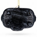 A black and gray Barbecue Grill Glass Christmas Ornament by BestPysanky hangs from a yellow string against a white background.