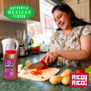 A woman slices red peppers in a kitchen. A Rico Rico Chipotle Morita Chile Powder Shaker sits prominently in the foreground, emphasizing the smoky, savory taste of authentic Mexican cuisine. The image features text that reads "Authentic Mexican Flavor" and "Rico! Rico!.
