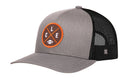 The Haka Hat Cleveland Trucker Hat | Black CLE X Football Snapback is a gray and black mesh trucker hat by Haka Hat, featuring a round orange CLE X embroidered patch with a football graphic on the front.