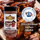 A bottle of Hickman's BBQ Competition Rub Package with chicken wings and the American Royal Kansas City logo. The text reads “2018 & 2025 Winner, 2nd Place Spicy Rub” and “Cougar Rub” from Hickman's BBQ—a competition rub crafted for layered flavor.