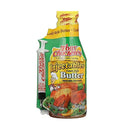 A bottle of DDR BBQ Supply Creole Butter marinade with an injection syringe, shown in colorful packaging featuring images of cooked meat.