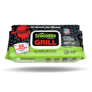 A green and black pack of Crocodile Cloth® Grill Wipes (80 Count) by Crocodile Cloth features “3X Larger” wipes designed for heavy-duty BBQ and grill cleaning with grill and crocodile graphics—do not flush. Perfect for outdoor cooking equipment.