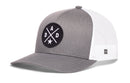 Grey and white Haka Hat Dad Trucker Hat with a circular black patch on the front featuring the word DAD and a star.