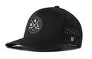 The Haka Hat Dallas Hockey Performance 5-Panel Hat | DAL X Flexfit Snapback by Haka Hat is a black baseball cap featuring a round logo with crossed hockey sticks, a puck, and the letters D A L on the front. Designed in a sleek performance 5-panel style, this Dallas Hockey Hat includes small ventilation holes on the side and a subtle Haka Hat “H” logo.