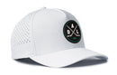 Introducing the Haka Hat Dallas Hockey Performance 5-Panel Hat | DAL X Flexfit Snapback—a white 5-panel hat featuring perforated side panels for breathability and a distinctive round front patch with crossed hockey sticks, DAL lettering, and bold black and green accents. The perfect addition to any Dallas hockey hat collection from Haka Hat.