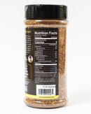 A clear plastic container of Chiles & Smoke Canyon Crust Beef Seasoning with a black lid is shown from the back. The label features nutrition facts, ingredients, a barcode, and the website chilesandsmoke.com at the bottom. Perfect as a robust BBQ rub for beef or a savory brisket rub, this versatile seasoning from Chiles and Smoke elevates any grilling experience.