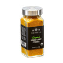 A 2.1 oz (59g) glass jar of The Spice Lab Organic Indian Curry Powder, featuring a silver lid and black label, filled with vibrant orange-yellow curry seasoning.