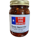 A 16 oz pint jar of DDR BBQ Supply Cherry Sweet Fire Pickles & Peppers with a gold lid and red, white, and blue label. Perfect BBQ sandwich topping packed with sweet heat pickles and peppers.