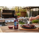 DDR BBQ Supply Big Wick's Blueberry Jalapeño Glaze bottle with dark blue cap and purple glaze.