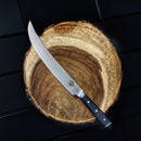 DDR BBQ Supply Spaceman Knives scimitar with blue honeycomb resin handle and Damascus steel blade on a wood board.