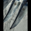 DDR BBQ Supply Spaceman Knives Interstellar Series steak knives with detailed Damascus steel blades on marble surface