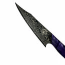A close-up of the Spaceman Knives Gravity Series Utility Knife by Spaceman Knives, showcasing AUS-10 steel with Damascus patterns and a deep purple marbled handle, displayed against a white background.