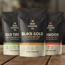 DDR BBQ Supply variety pack featuring Black Gold, Old Timers, and Redwood dry rub seasoning pouches on a wooden table.