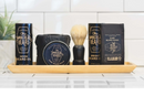 DDR BBQ Supply grooming set featuring Immaculate Beard soap, balm, oil, and wash on a wooden tray with a brush.