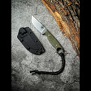 The Spaceman Knives Halimede Fixed Blade Knife, featuring a durable Micarta handle and black lanyard, rests beside its black sheath on a textured gray surface, with tree bark visible in the top right corner.