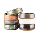 DDR BBQ Supply handmade ceramic shave bowls in various earthy glazes stacked for soap puck lathering.