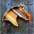 The Wooden Horse Head Serving Tray With Custom Engraving Options by Two Acre Woodworks features alternating light and dark wood stripes on a rustic, metal-studded surface—an eye-catching personalized tray for any occasion.